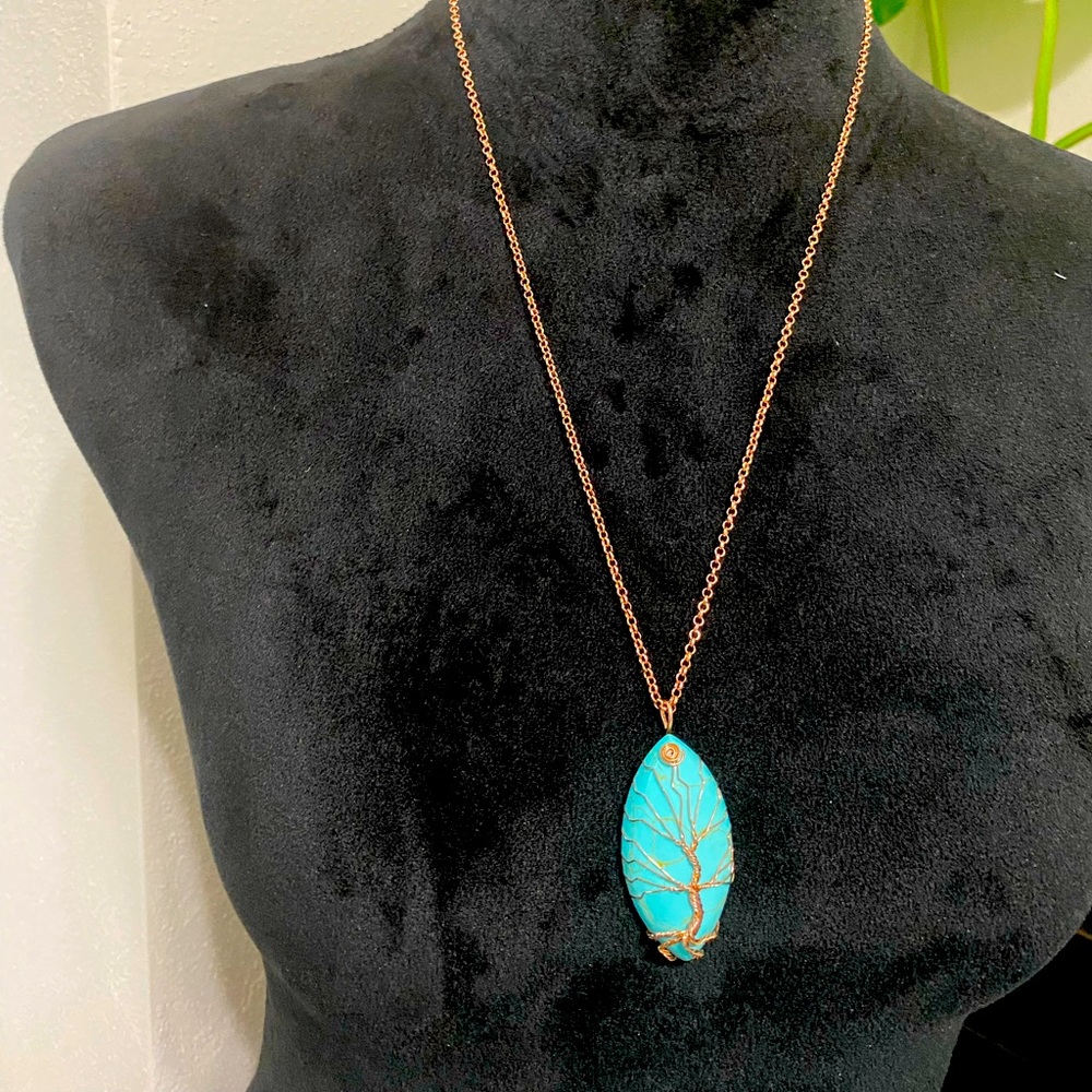 Rose gold stone necklace.